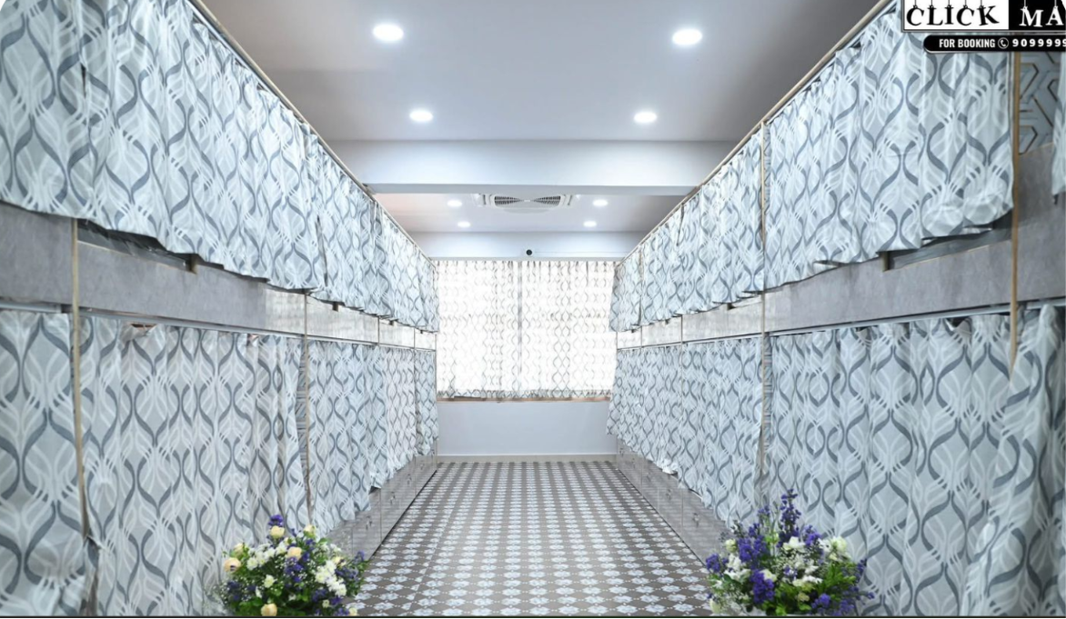 Inside a Skyline Backpackers dormitory — privacy-curtained pod bunks